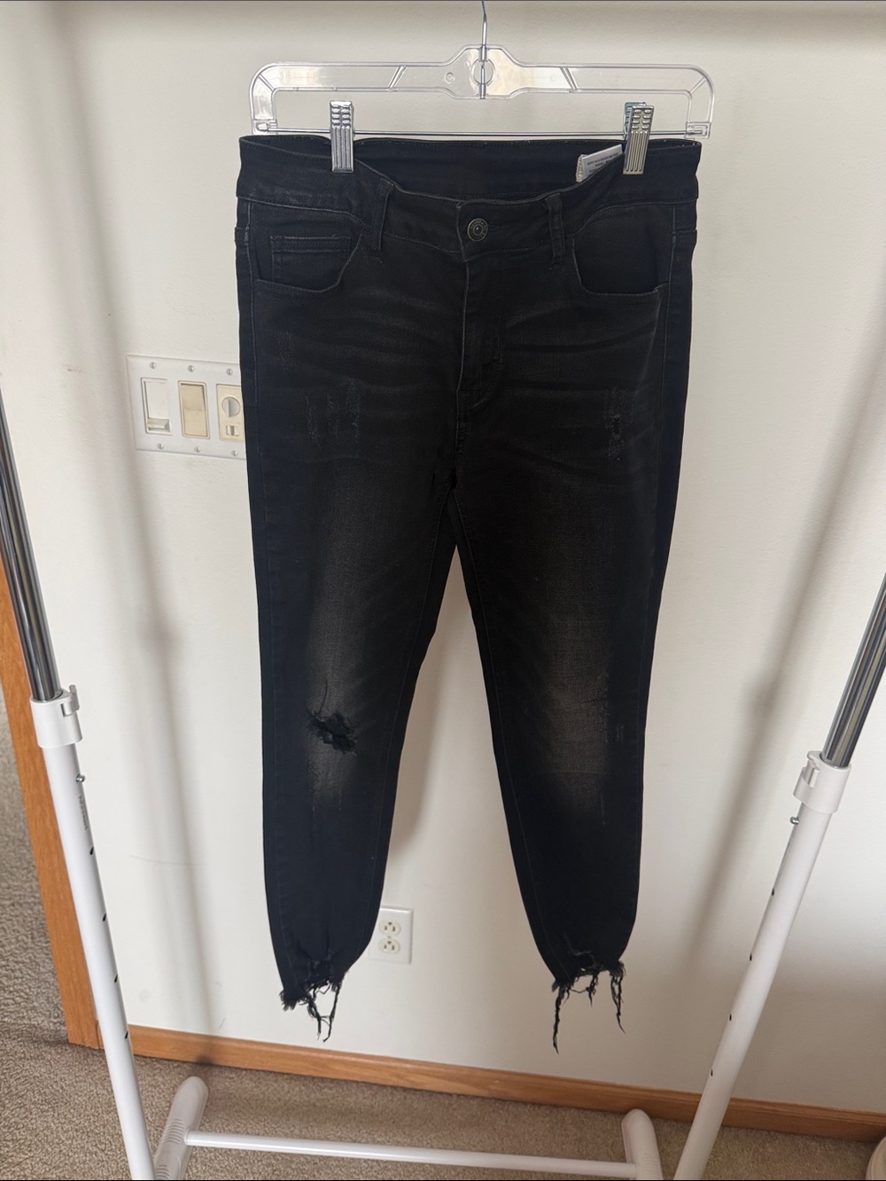 Women’s Black Skinny Jeans with Distressed Hem